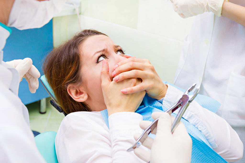 Closeup Patient scared of dental procedure
